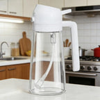 2 in 1 olive oil sprayer and dispenser bottle in a kitchen