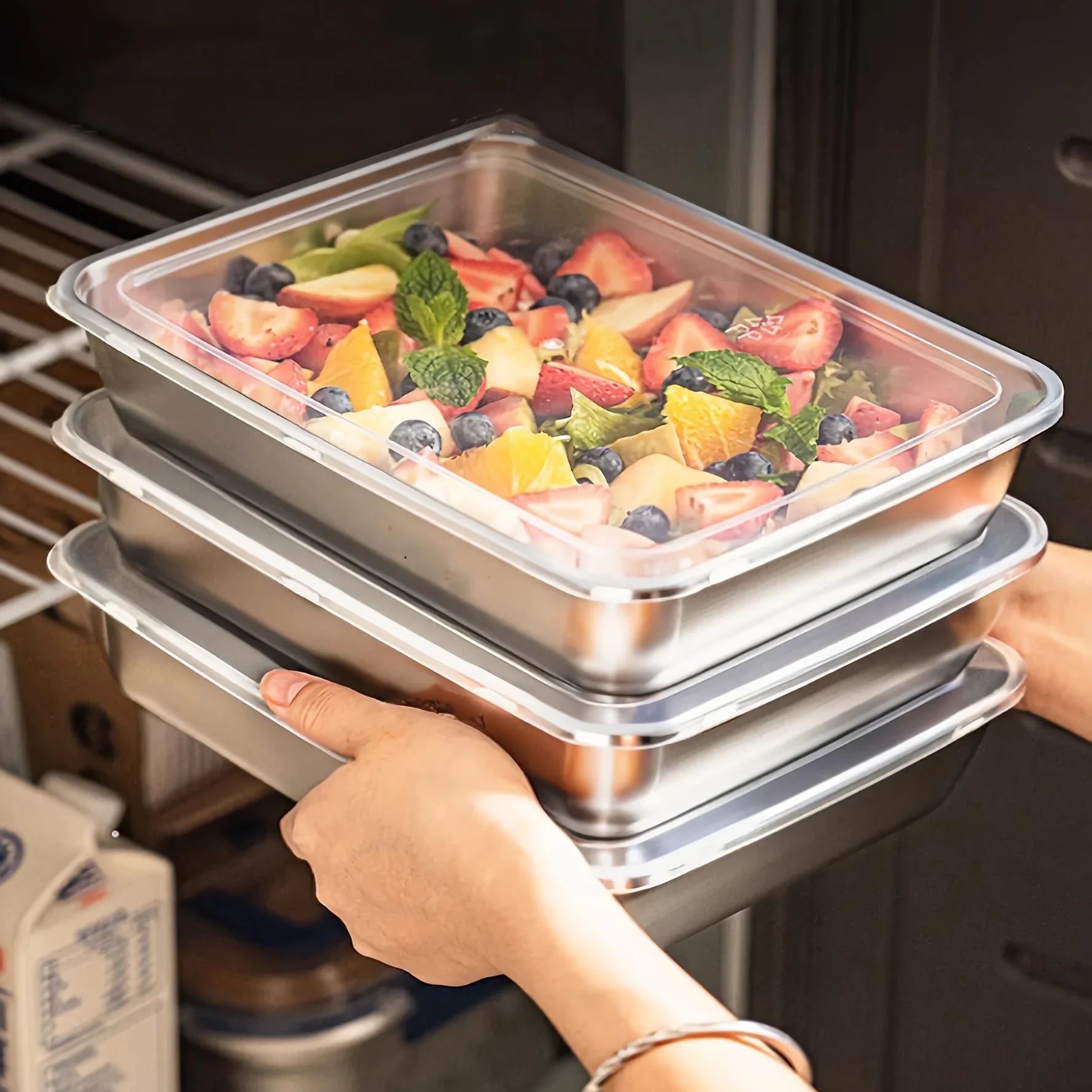 stack of stainless steel lunch containers with lids