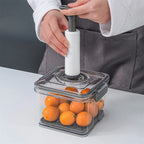 Person using vacuum food storage container